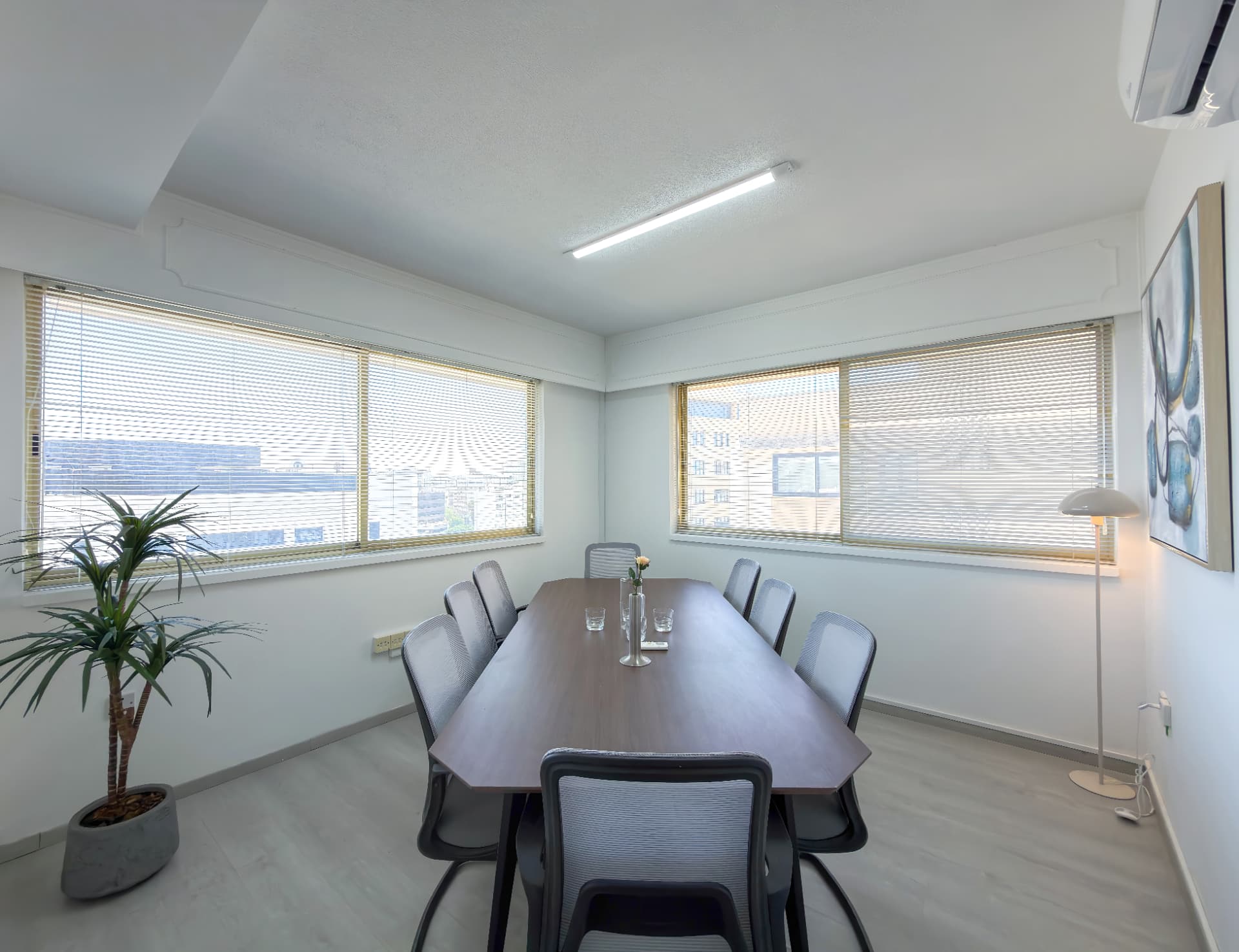 The Boardroom corner view with planting and floor lamp